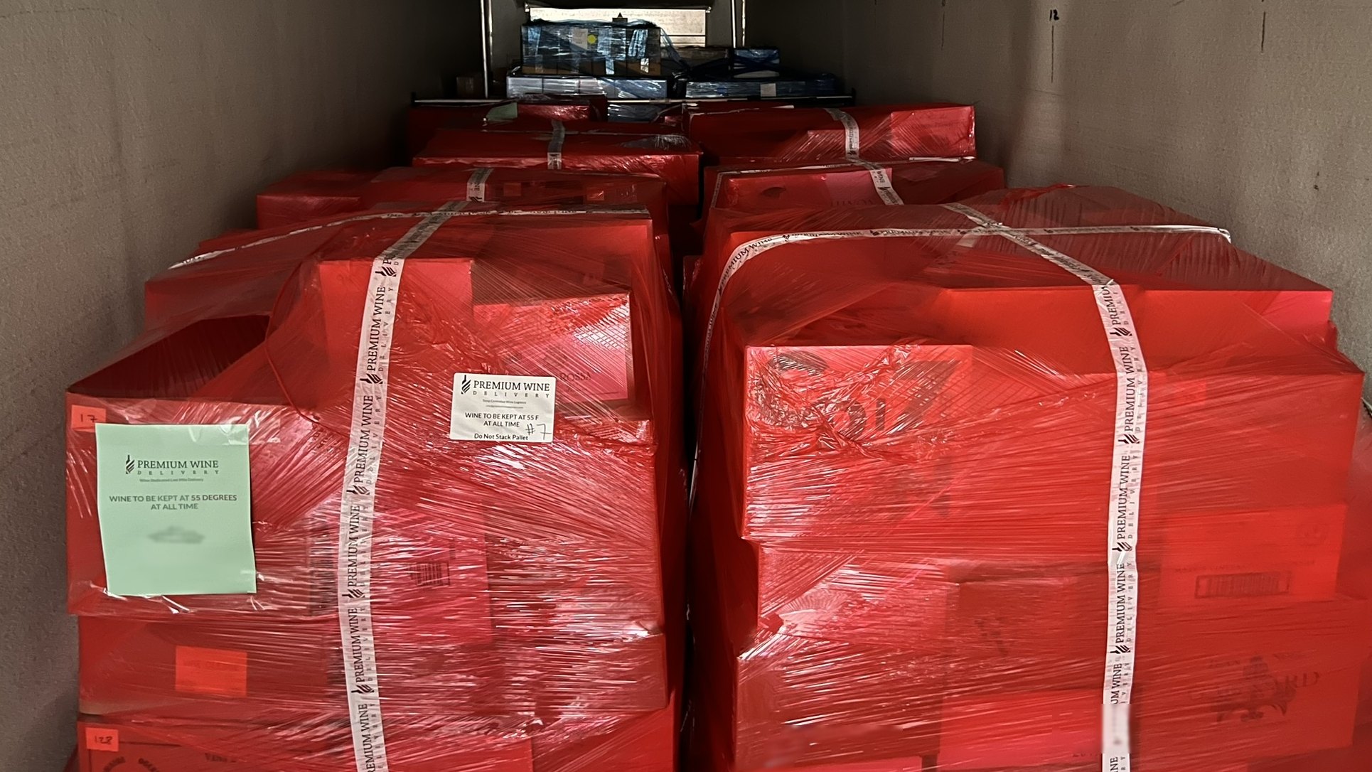 Palletised wine wrapped and banded inside a refrigerated trailer at the DFW dock